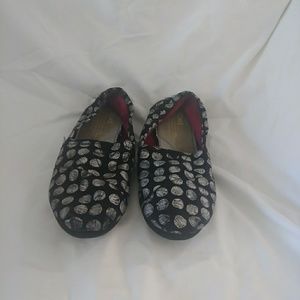 TOMS Black slip-ons.  Size 7